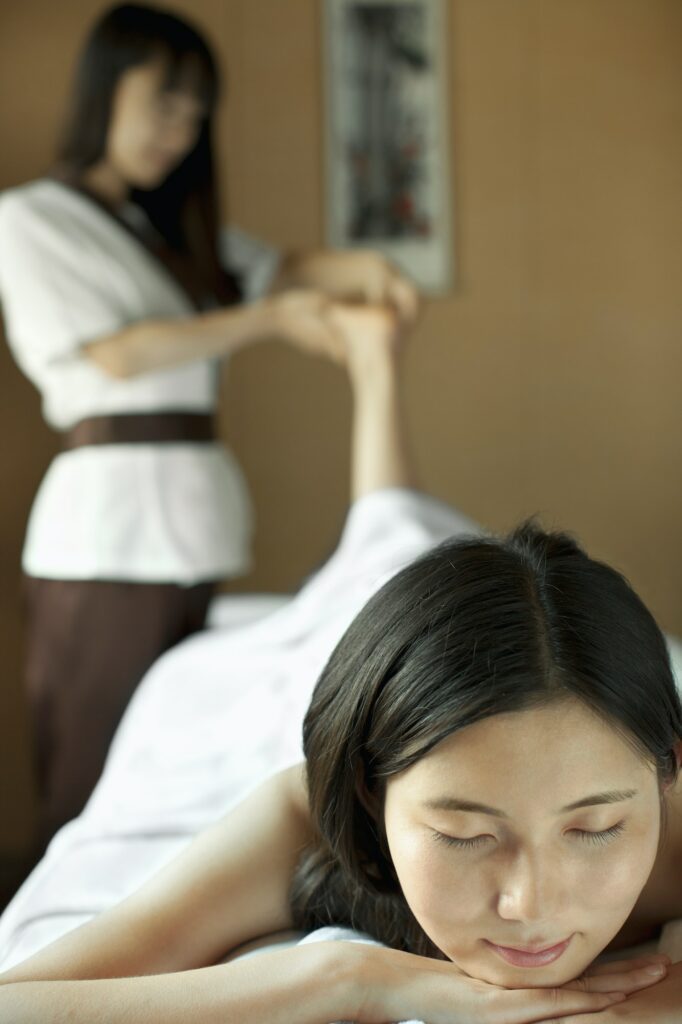 Massage Therapist Massaging Feet